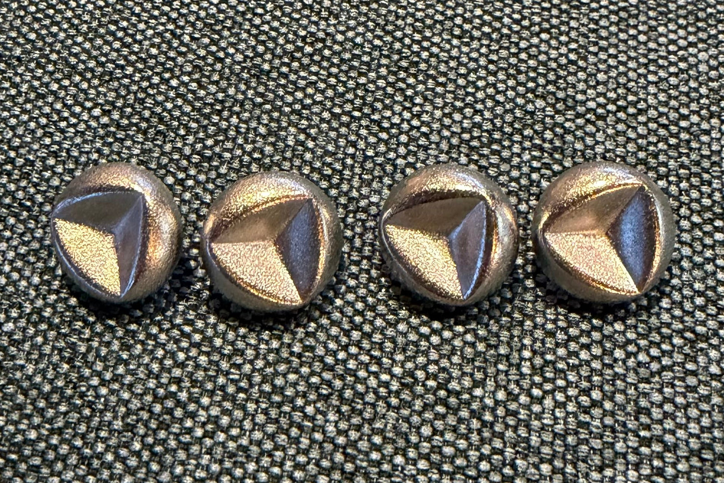 Set of decorative buttons on a textured surface