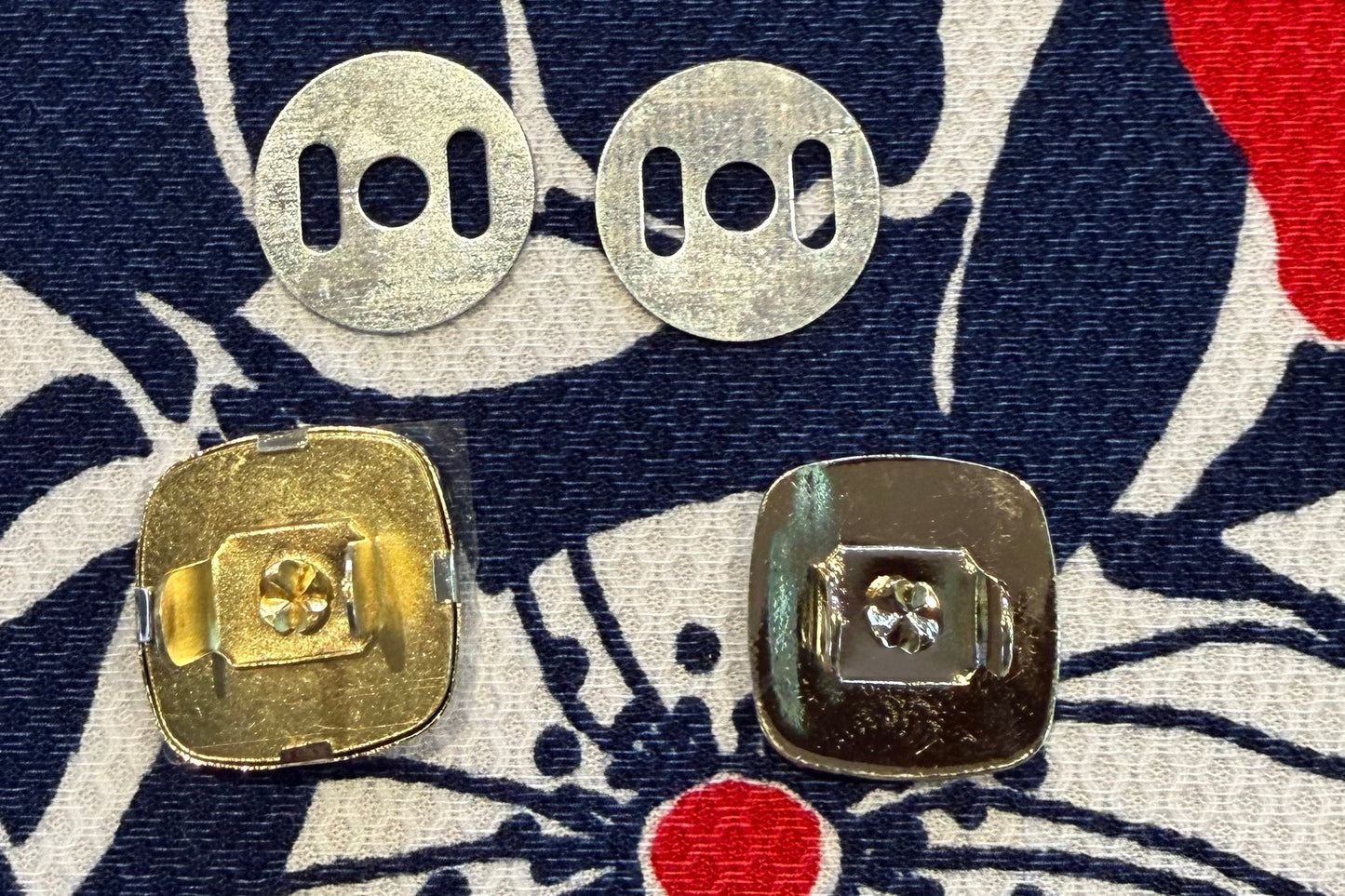 Metal snap set on a fabric with floral pattern